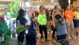 CFMEU members storm the Department of Transport and Main Roads’s building in Mary St, Brisbane.