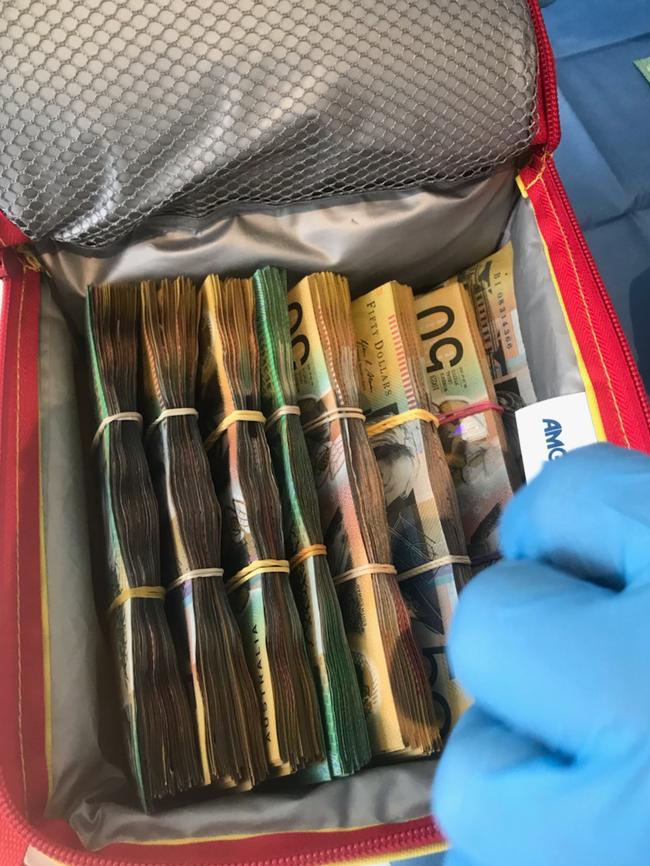 Cash found during a raid at a Miranda home.