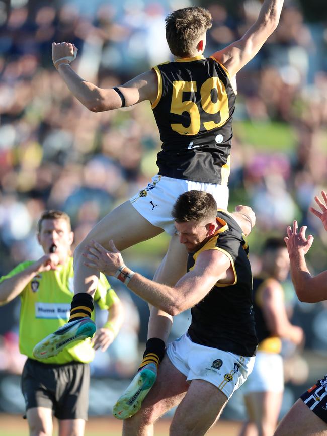 Connor O'Sullivan soars over the top of Albury teammate Isaac Muller.