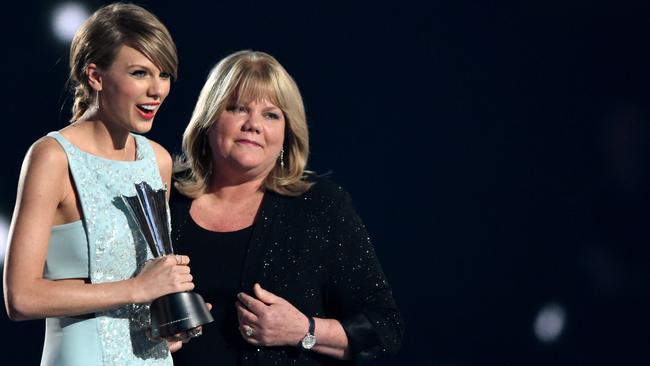 Taylor Swift accepting the Milestone Award from her mother Andrea Swift during the 50th Academy Of Country Music Awards in 2015. Picture: Cooper Neill/Getty Images