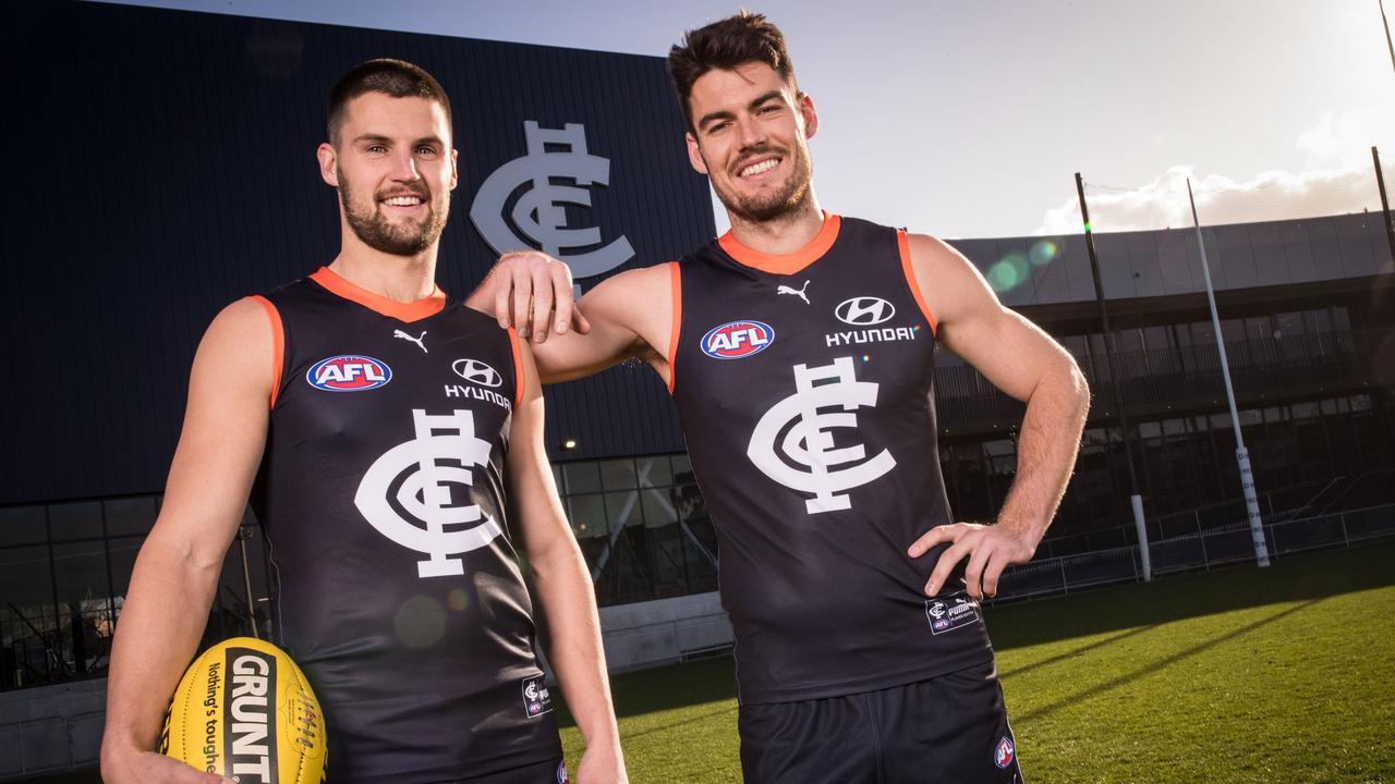 Blues footballers Nic Newman (left) and George Hewett model the club’s Carlton Respects guernseys. Picture: Getty Images