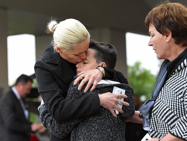 The Lekaj family’s life has been destroyed. Brother Pyrrhus being comforted by mother Romina and grandmother. Picture: Tom Huntley