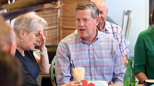 Queensland Opposition Leader Tim Nicholls chats to his mother Barbara as he meets friends and family at a Brisbane cafe the day after the election. Picture: AAP/Dan Peled