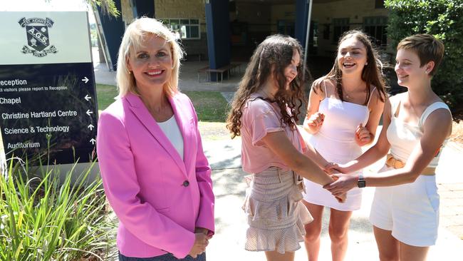 Principal of St Aidan's Corinda Toni Riordan with students Alice Baumann, Genevieve Rule and Phoebe McAuliffe. The students have just received their OP scores. picture: AAP/Richard Waugh 