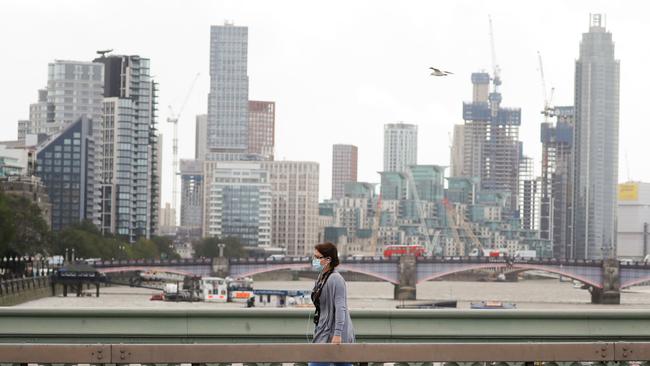 A woman walks on Westminster Bridge in central London. Picture: AFP