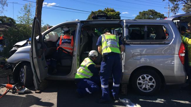 Emergency crews had to remove a door to a van after it crashed in Hebersham on Friday afternoon, trapping two people. Picture: CareFlight media.