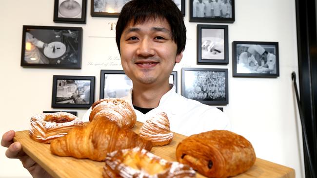 Pastry chef Justin Yu is the owner of The Whisk at Upper Mount Gravatt, his pastries are so popular he usually sells out before lunchtime. Picture AAP/David Clark