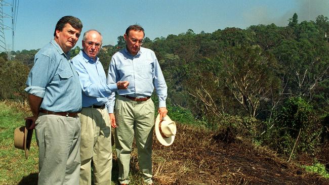 Busaco Rd, Marsfield. Then as the state Liberal MP for Eastwood, Mr Tink, Prime Minister John Howard and NSW Premier Bob Carr looking at the damage by bushfire in the Epping area. Picture: Mick Tsikase