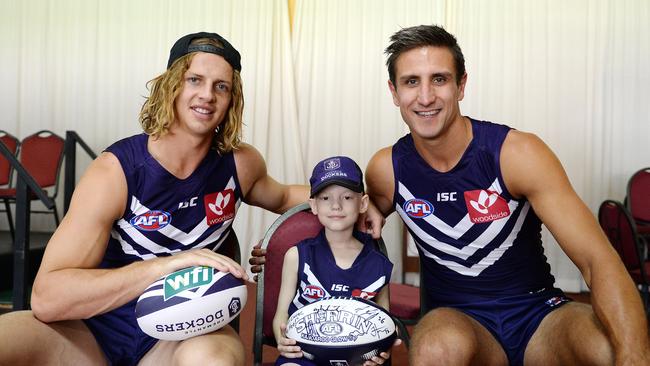 A young Fyfe with Matthew Pavlich with Lucas (7) from the Starlight Childrens Foundation