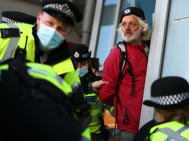 A protester is arrested by Police on Clapham High Street during the anti-lockdown demonstration on January 9, 2021 in London, as British cases soar. Picture: Hollie Adams/Getty Images