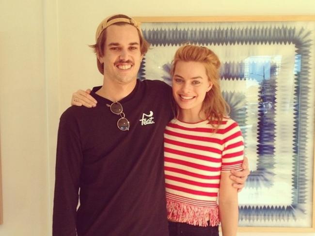 Margot Robbie and local artist Nicholas Chalmers during her fleeting visit to the Gold Coast.