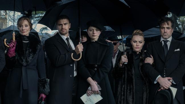 The Duke's funeral in The Gentlemen (2024, Netflix), Joely Richardson far left, then Theo James, and far right, Daniel Ings