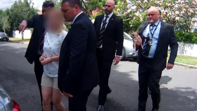 Police arrest Ms Crabtree yesterday in Brisbane.