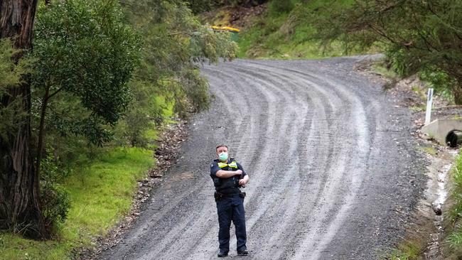 A policeman on Victoria St, where the search came to a tragic end. Picture: Mark Stewart