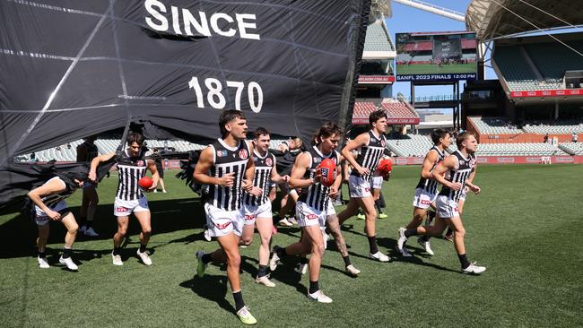 Magpies players run onto the field during ahead of the SANFL elimination final in September. Picture: David Mariuz/SANFL