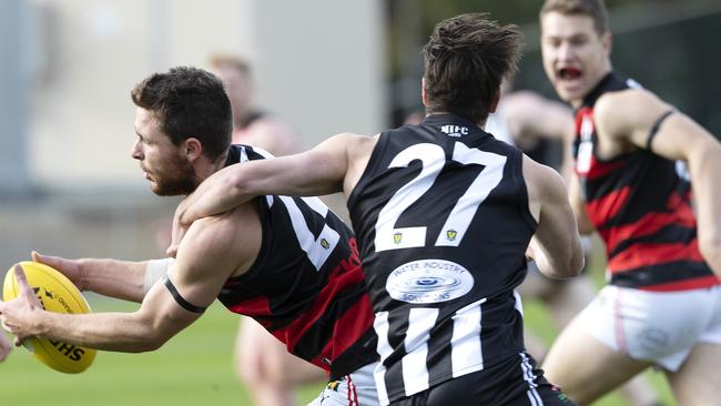 Glenorchy’s Ben Kamaric corrals Lauderdale’s Nat Franklin. Picture: CHRIS KIDD