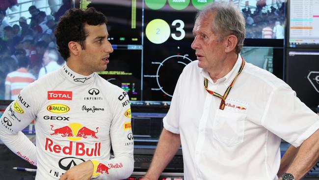 Ricciardo talks with Marko in the Red Bull garage at Sepang.
