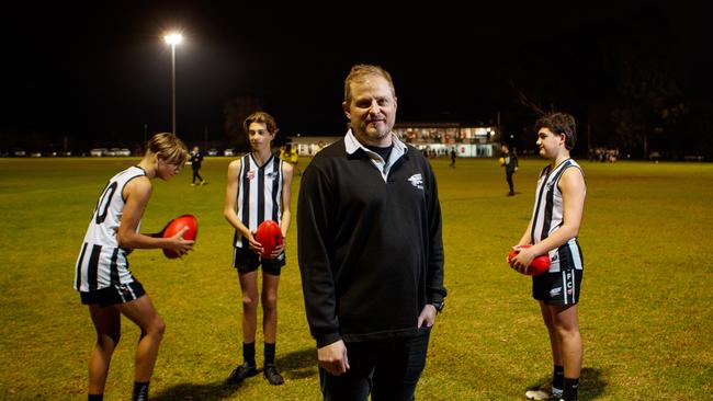 Payneham Norwood Union Football Club president Tyson Burrows with under 14 players (LtoR) Zac Herbert, Jay Saunders and Thomas Fotheringham at Payneham Oval on June 17, 2021. Picture: Matt Turner.