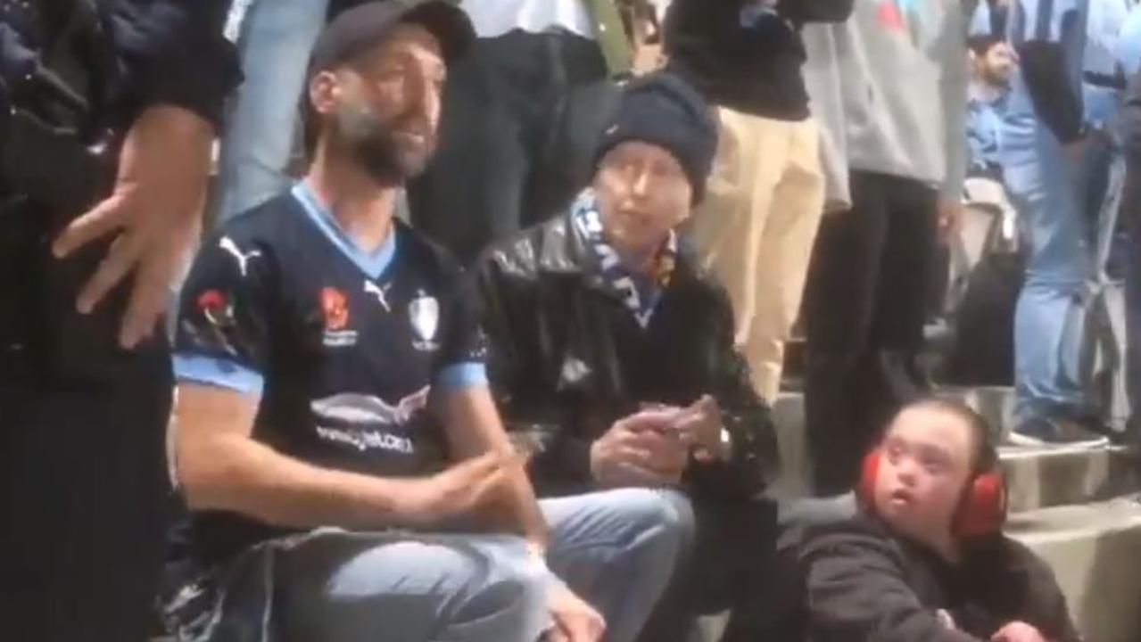 The evicted fan being spoken to by NSW Police officers.