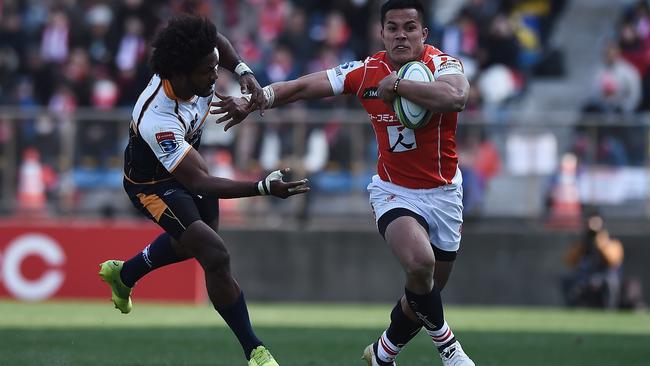 Henry Speight attempts to catch Hosea Saumaki of the Sunwolves during the Brumbies’ win in Tokyo on Saturday. Picture: Getty Images