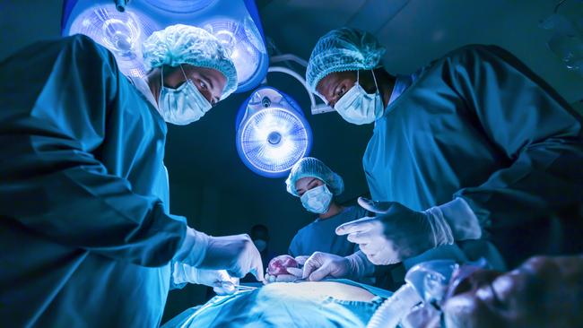 A surgeon has been reprimanded and fined after sharing a photo of a comatose patient’s penis, which was tattooed with a swastika.