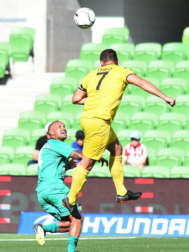 Archie Thompson and Michael Theo contest a header. Picture: Josie Hayden
