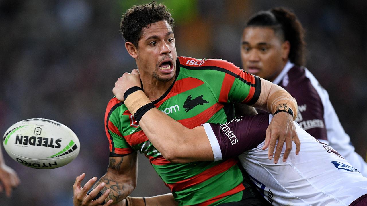 Dane Gagai of the Rabbitohs loses the ball as he is tackled by Reuben Garrick