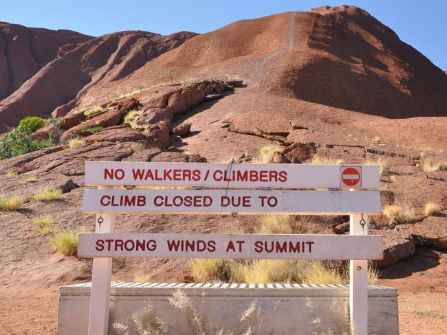 The “closed” sign at the base of Uluru. Picture: Zach Hope