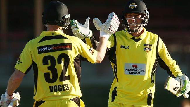 Western Australia’s Adam Voges and Sam Whiteman celebrate victory over Tasmania.
