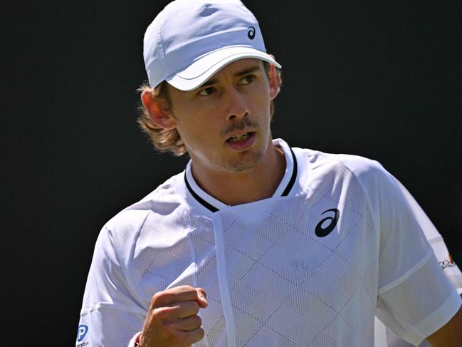 Australia's Alex De Minaur reacts after winning a point against Spain's Jaume Munar during their men's second round singles tennis match on the fourth day of the 2024 Wimbledon Championships at The All England Lawn Tennis and Croquet Club in Wimbledon, southwest London, on July 4, 2024. (Photo by Glyn KIRK / AFP) / RESTRICTED TO EDITORIAL USE