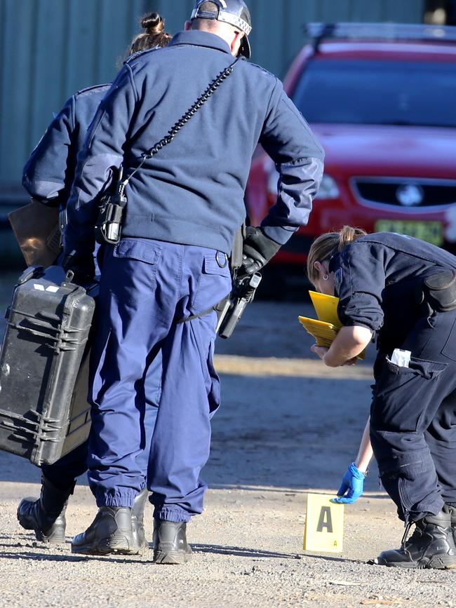 Police at the scene of the alleged home invasion. Picture: John Grainger