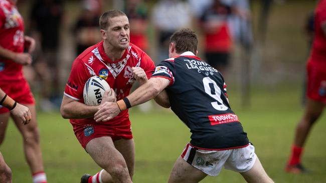 Kyle Lang runs at Zade Besley. Picture: Julian Andrews