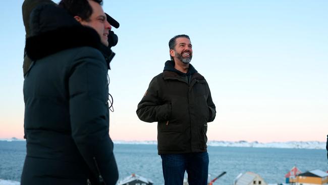 TOPSHOT - US businessman Donald Trump Jr. looks on after arriving in Nuuk, Greenland on January 7, 2025. Donald Trump Jr made a private visit to Greenland, a Danish autonomous territory coveted by Trump Sr and which hopes to one day be independent but remains dependent on Copenhagen for now. (Photo by Emil Stach / Ritzau Scanpix / AFP) / Denmark OUT