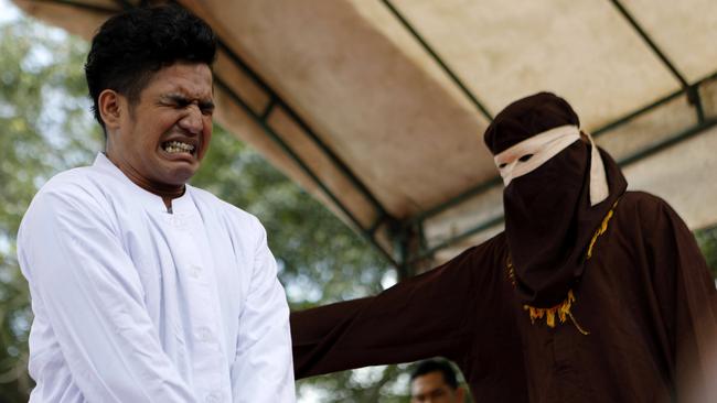 An Acehnese man is whipped in front of the public for violating sharia law in Banda Aceh, Indonesia, 27 February 2017. His crime was having sex without being married. Picture: EPA / Hotli Simanjuntak