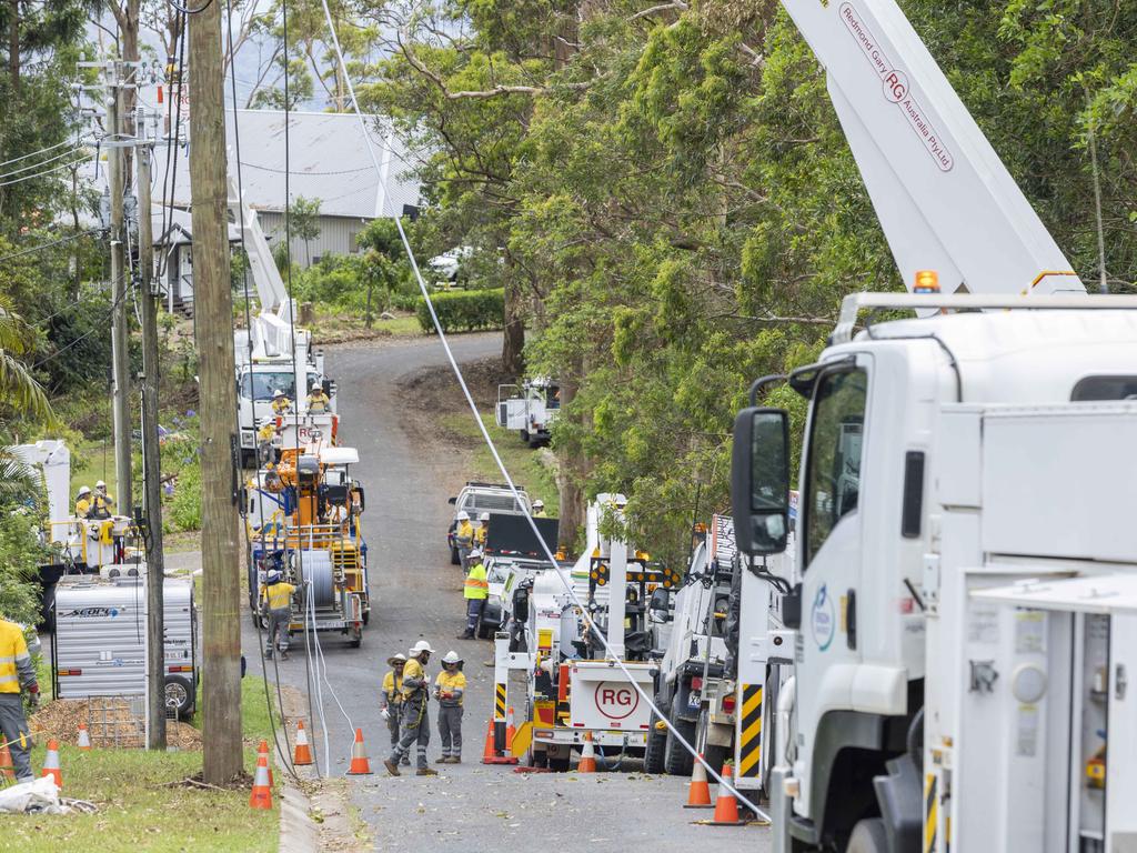 Energex crews continue storm clean-up at Kinabalu Drive, Tamborine Mountain, on Saturday. Picture: Richard Walker