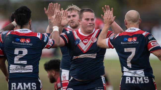 Camden Rams players celebrate their hard fought win over East Campbelltown, L-R John Ryan, Jack Simpson and Brad Speechley. Pics by Julian Andrews.