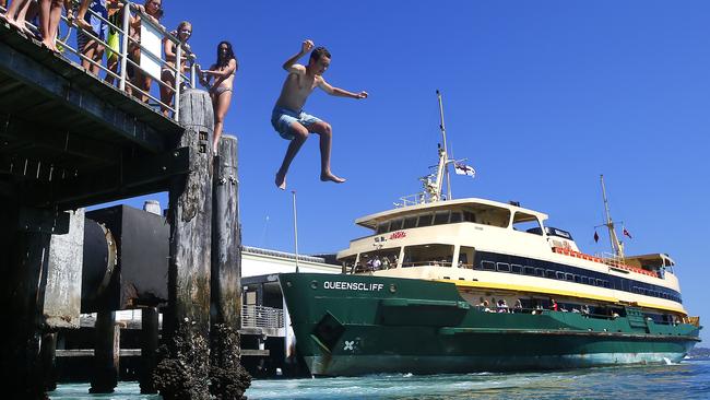 Kids on their school holiday's cool down at the Manly Ferry Wharf in 2014. Picture: Bradley Hunter