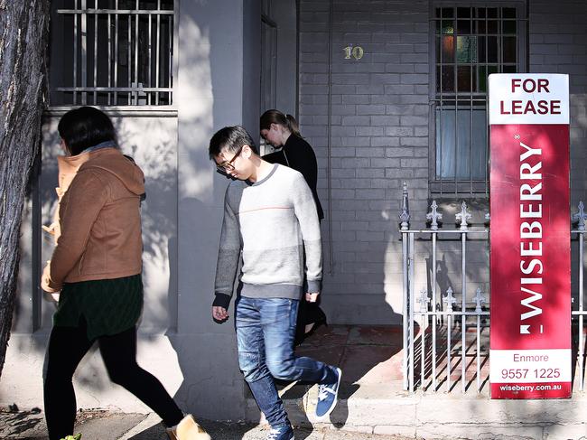 A couple leaves after inspecting 10 Rawson Street, NEWTOWN NSW 2042Photographer: Adam Yip