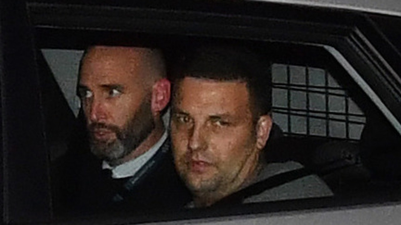 Zlatko Sikorsky (right) is seen in a police vehicle arriving to Maroochydore Police Station IN 2018 after a siege at an Alexandra Headland unit complex. Picture: AAP Image/Darren England