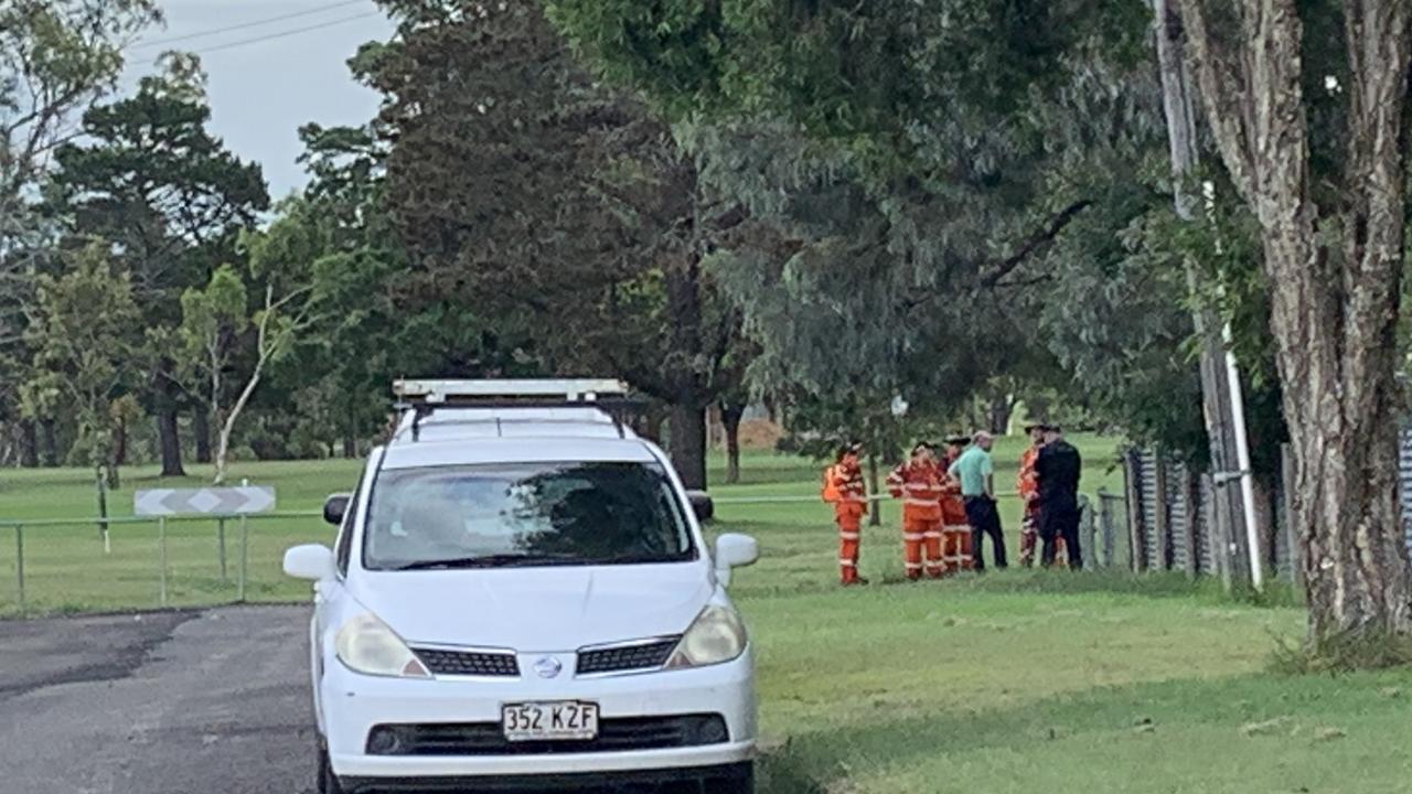 State Emergency Services volunteers and police gather at the golf course behind the home of Krishna Chopra. Picture: Rowan Morris