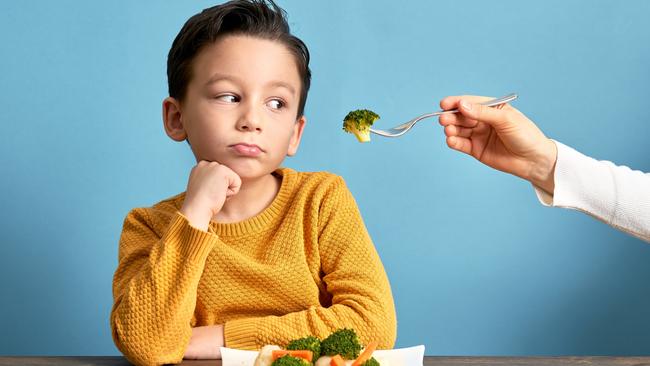 Child is very unhappy with having to eat vegetables. There is a lot of vegetables on his plate. He hates vegetables.