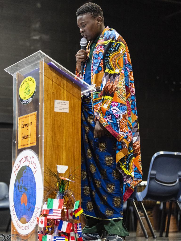 Joshua Mukeba tells his story as a member of the Democratic Republic of the Congo community to the school assembly during Harmony Day celebrations at Darling Heights State School. Picture: Kevin Farmer