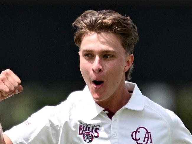 BRISBANE, AUSTRALIA - OCTOBER 21: Tom Whitney of Queensland celebrates taking the wicket of Wes Agar of South Australia during the Sheffield Shield match between Queensland and South Australia at Allan Border Field, on October 21, 2024, in Brisbane, Australia. (Photo by Bradley Kanaris/Getty Images)