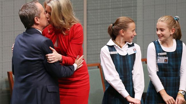 Opposition Leader Bill Shorten gets a kiss from wife Chloe after his Budget reply speech in May. Picture: Stefan Postles, Getty Images