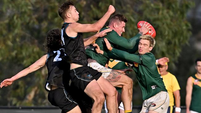 NFL: Old Eltham Collegians’ Matthew Keys takes a contested grab. Picture: Andy Brownbill