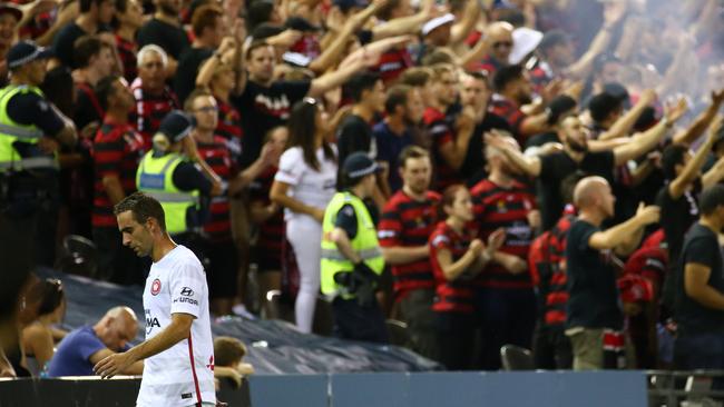 Western Sydney Wanderers defender Alberto Aguilar takes the walk of shame after his red card.