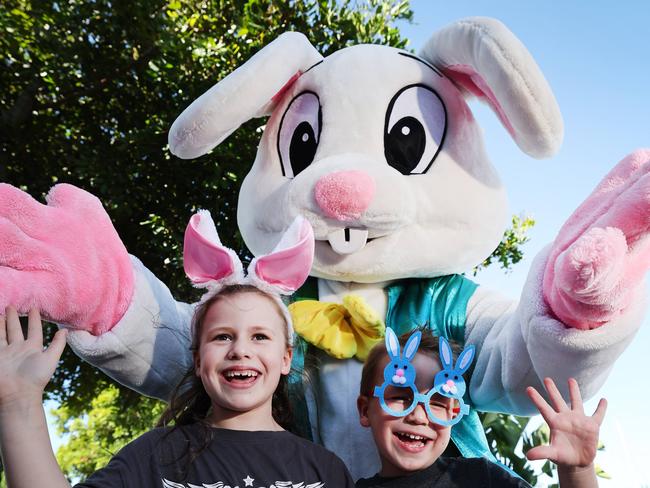 Getting ready for the Easter Eggstravaganza at Sanctuary Cove are siblings Elodie Barnard 6 and Lincoln Barnard 3, together with Pickles the bunny and EB the Easter Bunny. Picture Glenn Hampson