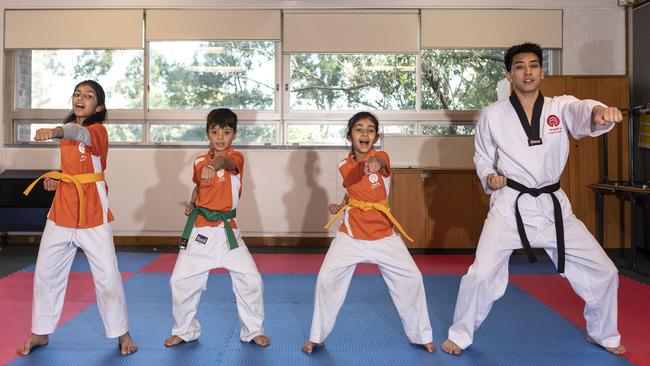 Izzah Jasim, 9, Josiah Smith, 7, Amayra Sikarwar, 7, and teacher Danny Taing at Inspire Carlingford which provides martial arts lessons. Picture: NCA NewsWire/ Monique Harmer