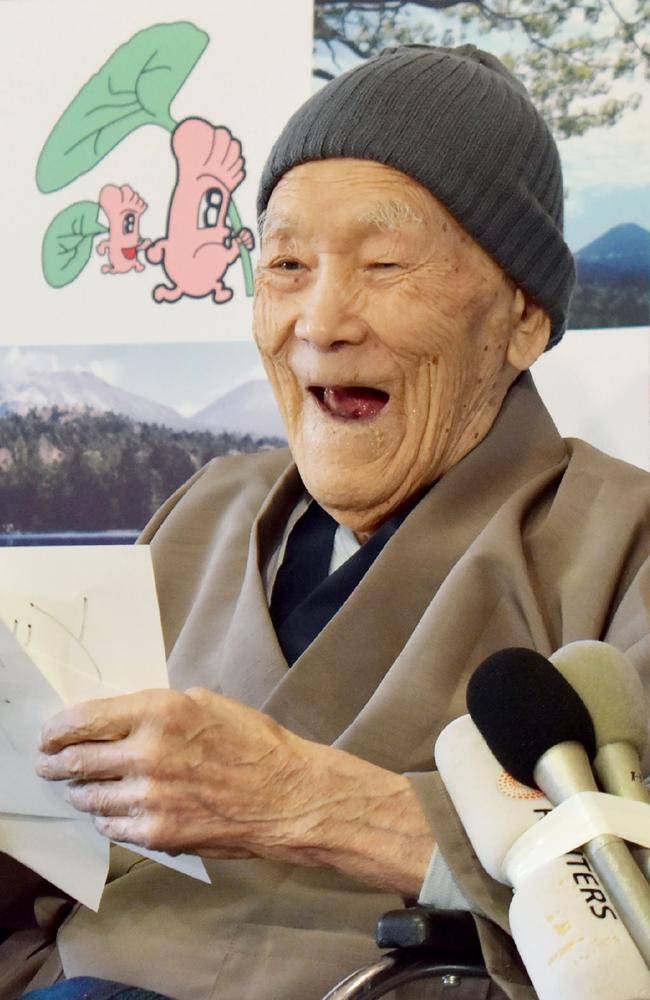 Masazo Nonaka of Japan, aged 112, smiles after being awarded the Guinness World Records' oldest male person living title. Naturally he celebrated with cake. Picture: AFP/Jiji Press