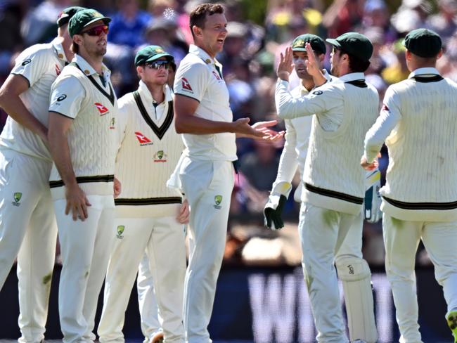 CHRISTCHURCH, NEW ZEALAND - MARCH 8: Josh Hazlewood of Australia (C) is congratulated by team mates after dismissing Kane Williamson of New Zealand during day one of the Second Test in the series between New Zealand and Australia at Hagley Oval on March 8, 2024 in Christchurch, New Zealand. (Photo by Kai Schwoerer/Getty Images)